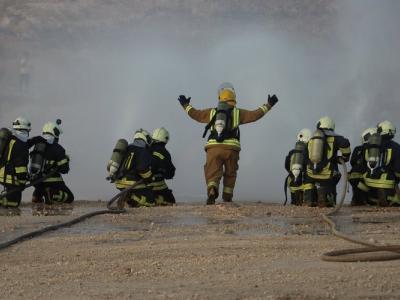 White helmets extinguishing fire 
